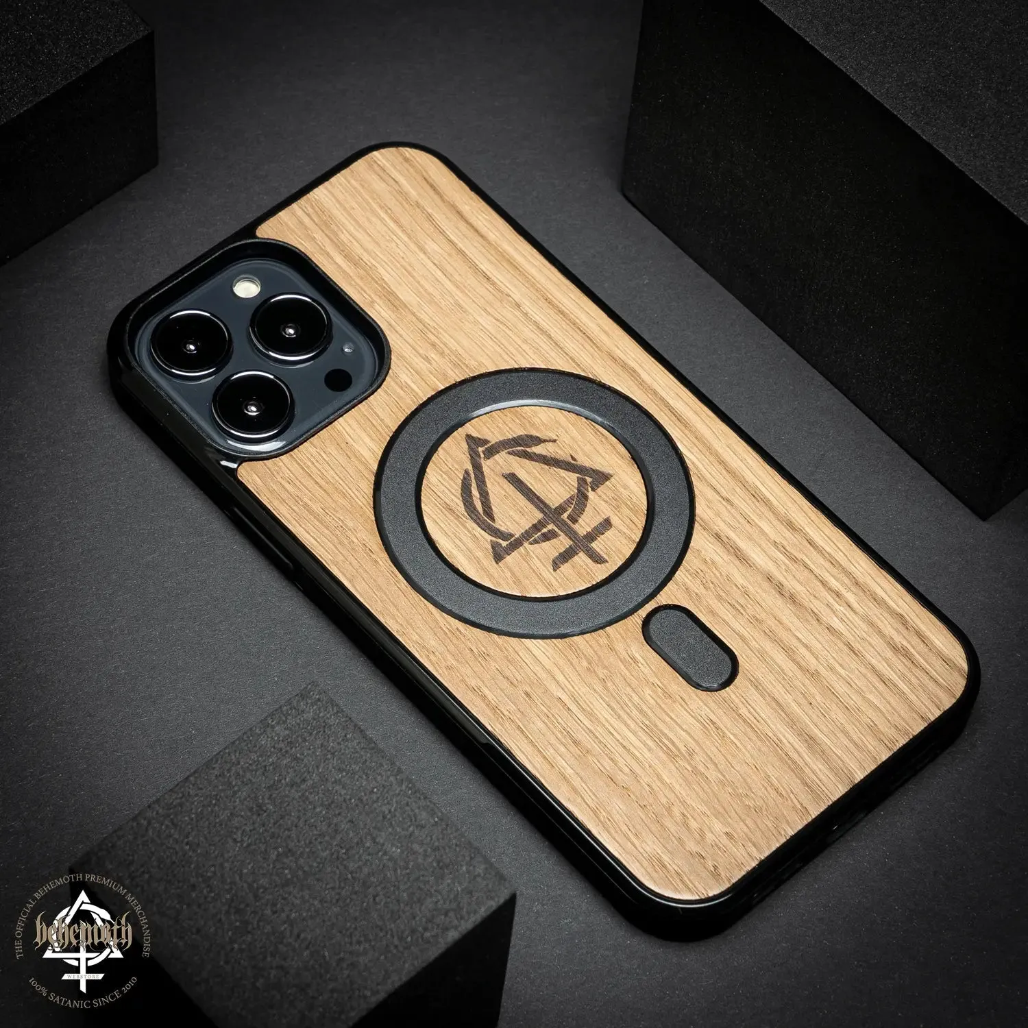 iPhone 13 Pro Max case with wood finishing and Behemoth 'CONTRA' logo